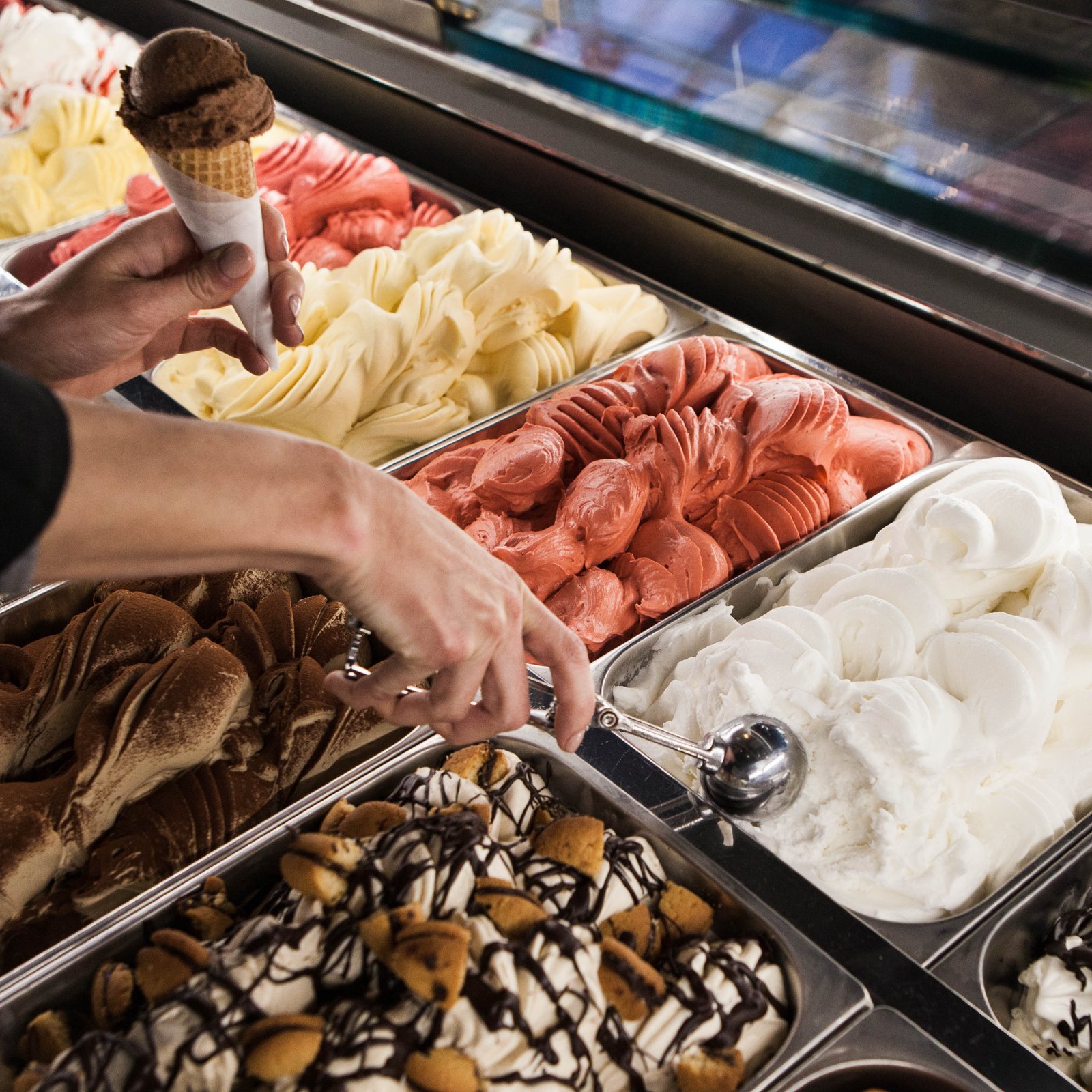 Artisanal gourmet gelato and ice cream bar with fresh scoops served in crisp waffle cones.